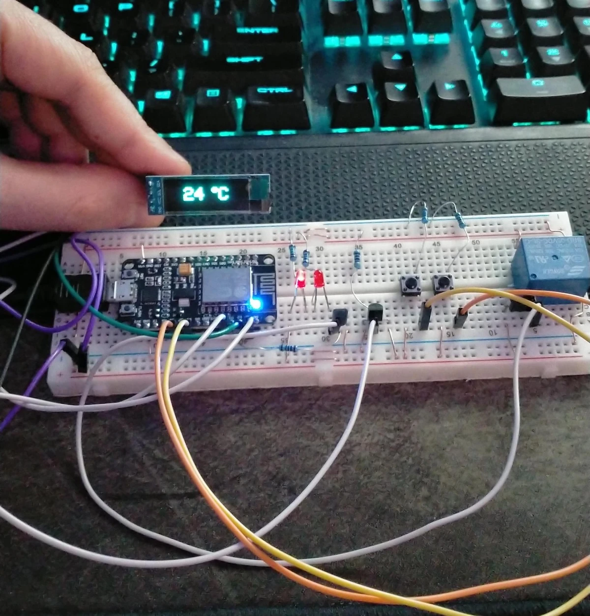 Breadboard prototype of the DIY thermostat with ESP8266, display, and wiring